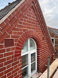 Repointing of a late 19th Century Townhouse, faced cleaed before repointing with a 2mm tuck pointed ribbon applied to the semi-circular arch.