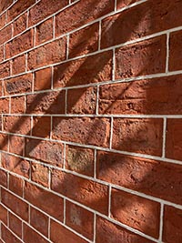 A cross sectional view of a cleaned and tuckpointed wall completed in Shrewsbury.